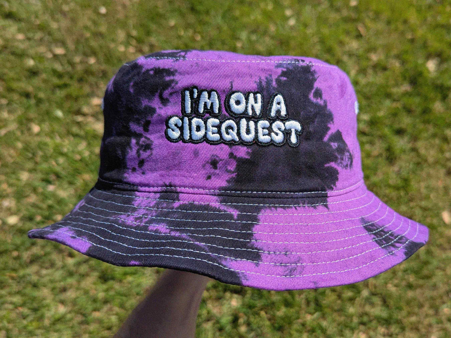 `Purple and black tie dye "I'm On A Sidequest" embroidered bucket hat, handmade festival rave hat`