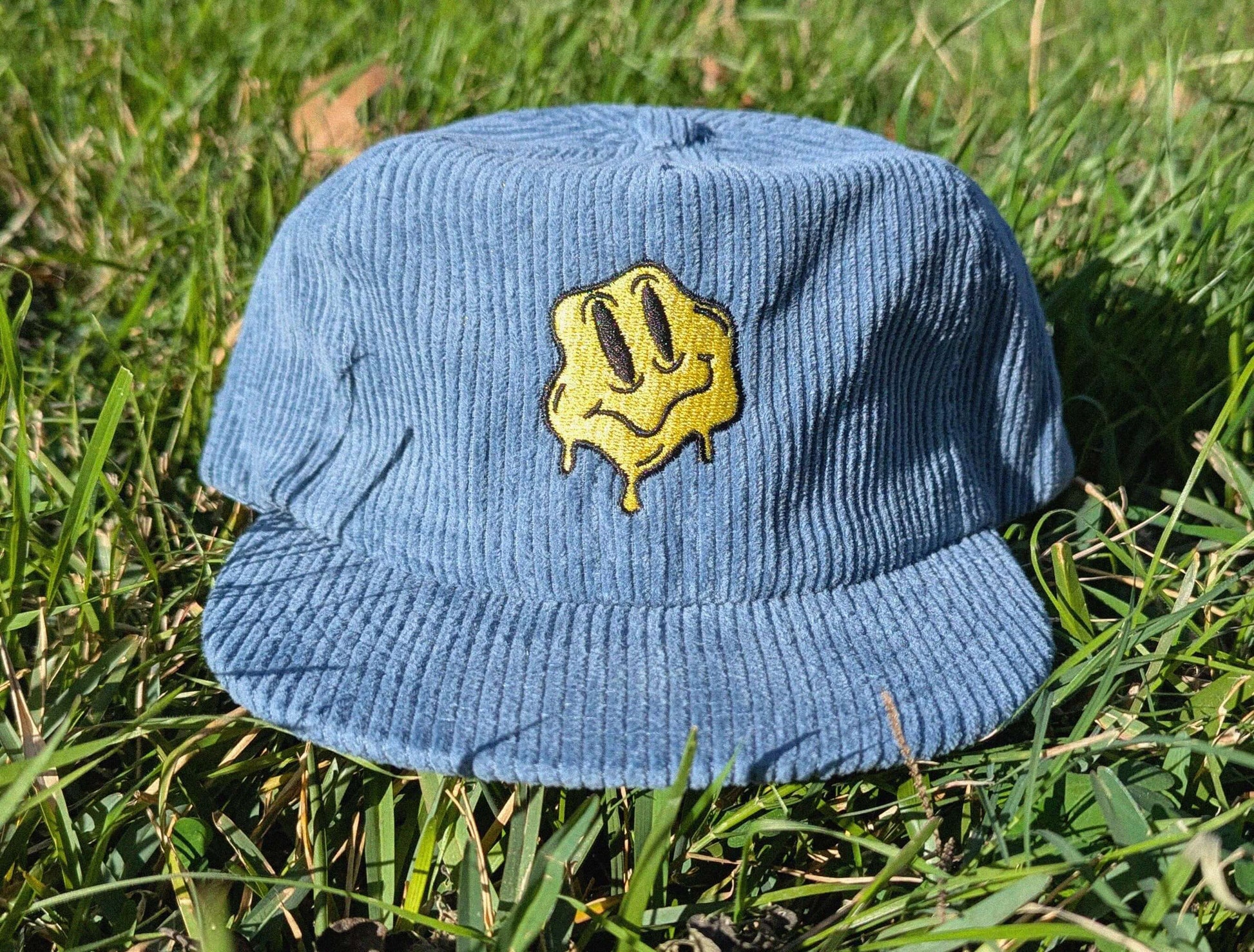 Melting smile embroidered rave corduroy cap