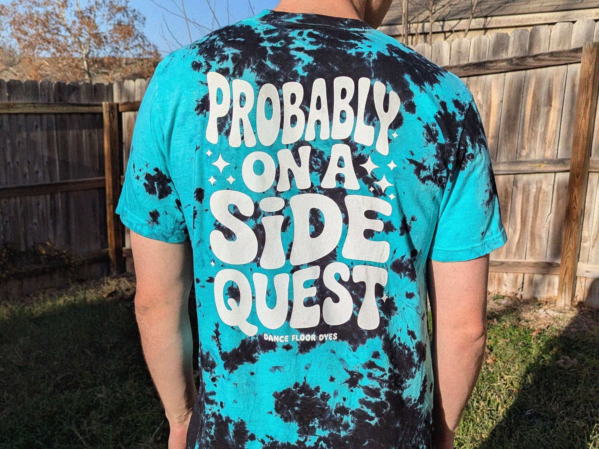 Teal and black tie dye probably on a side quest rave shirt festival tee