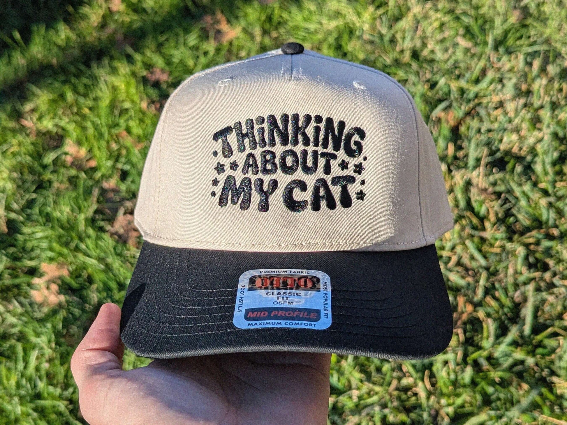 Tan and black thinking about my cat trucker cap rave festival hat OTTO