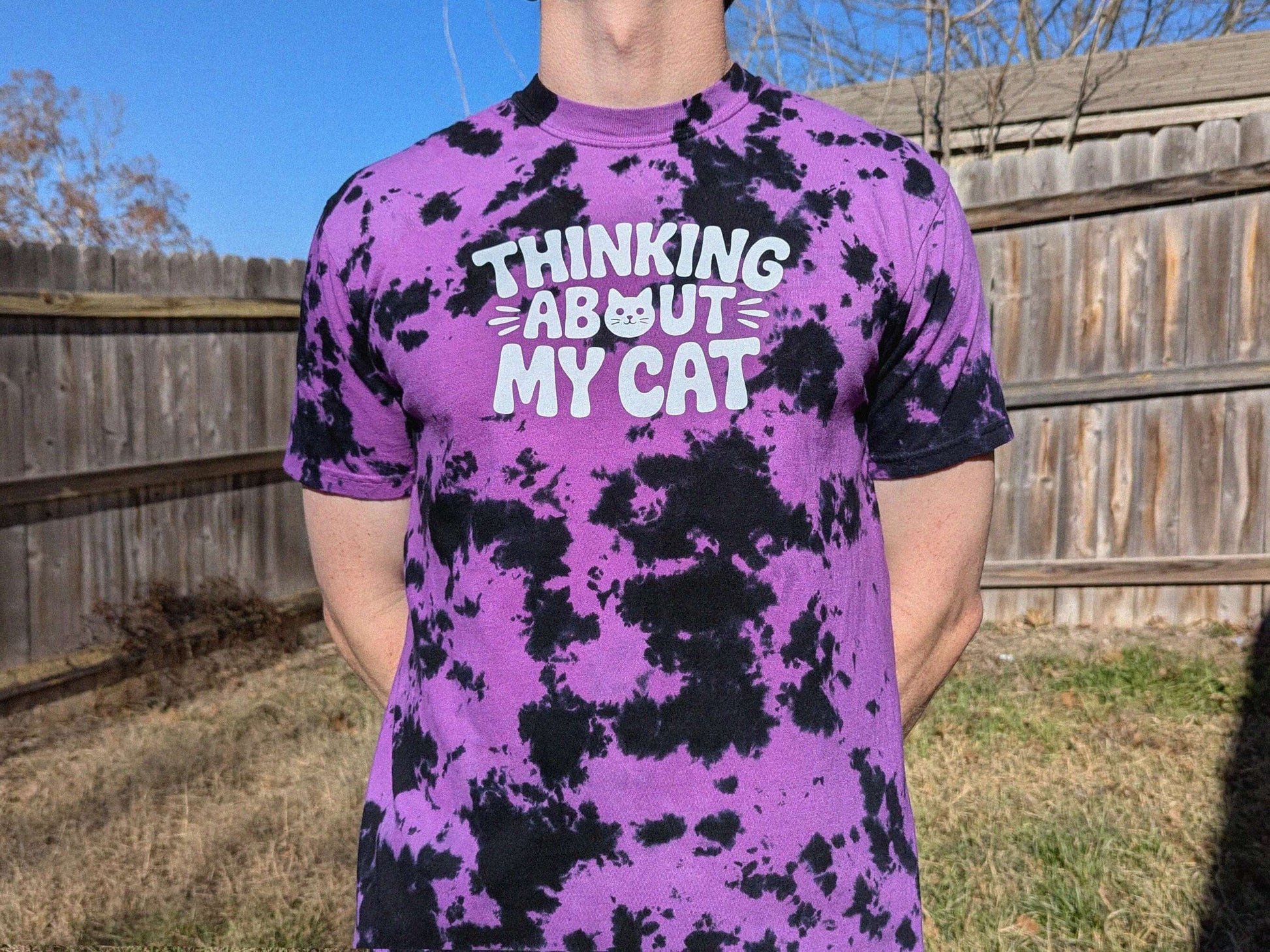 Purple and black tie dye festival shirt with Thinking About My Cat graphic design