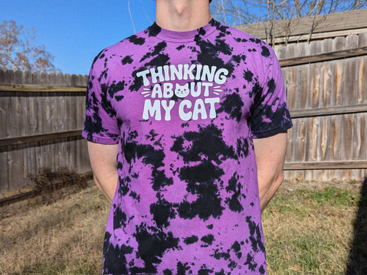 Purple and black tie dye festival shirt with Thinking About My Cat graphic design