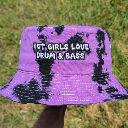 tie dye bucket hat with 'Hot girls love drum & bass' embroidery