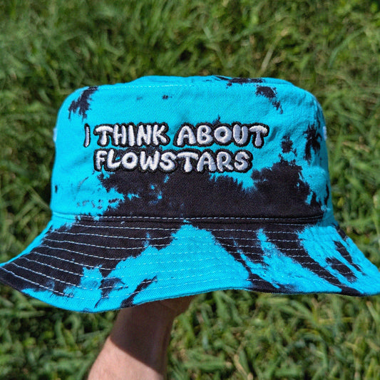 Blue and black bucket hat with text 'I THINK ABOUT FLOWSTARS' 