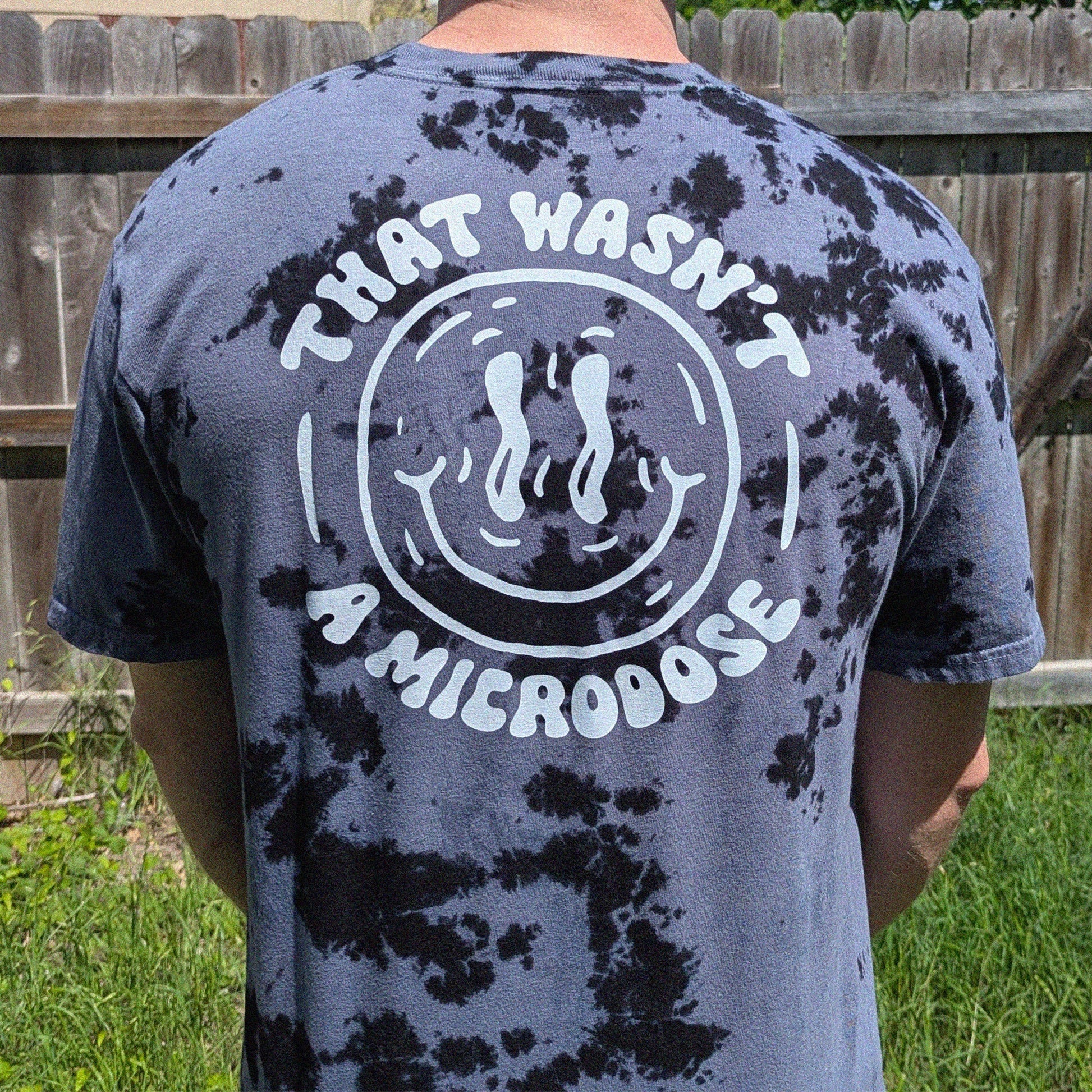 tie-dye t-shirt with 'That wasn't a microdose' screen printed on the back