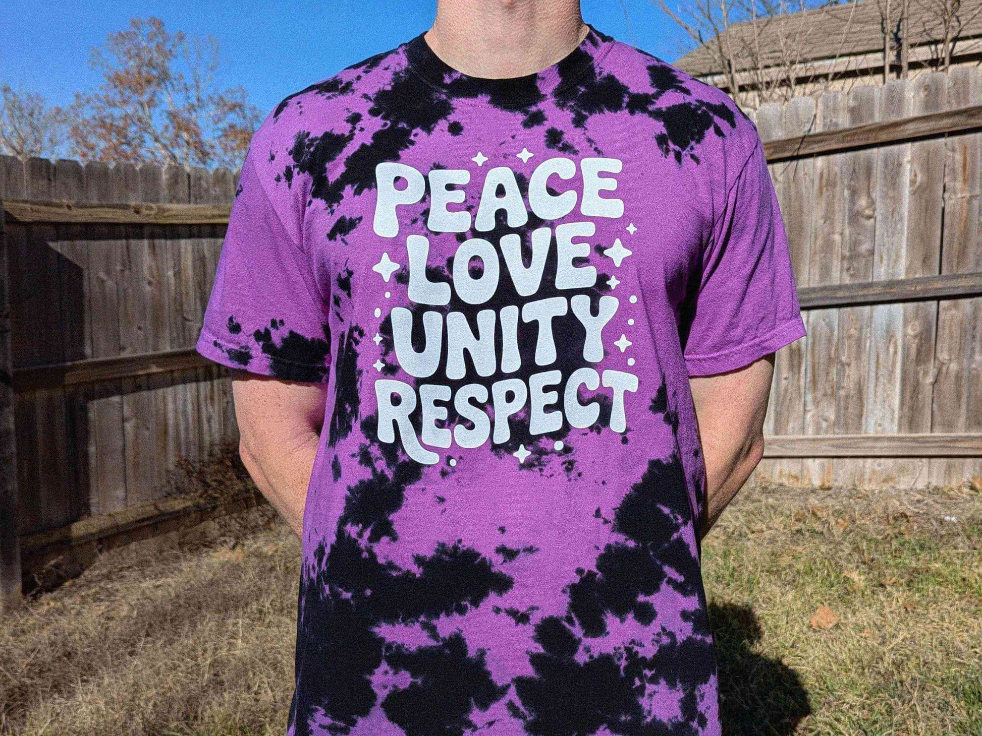 Unisex purple tie dye PLUR shirt with Peace Love Unity Respect design, rave clothing for EDM festivals and electronic music events