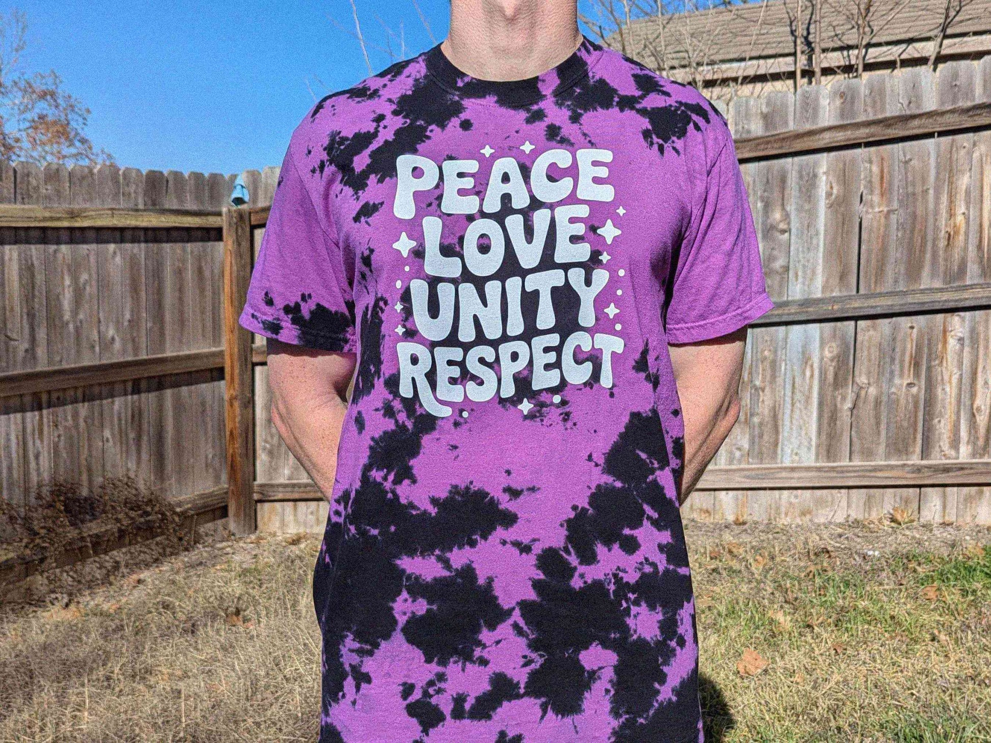 Purple black tie dye rave shirt with bold PLUR slogan, Peace Love Unity Respect festival top for EDM lovers