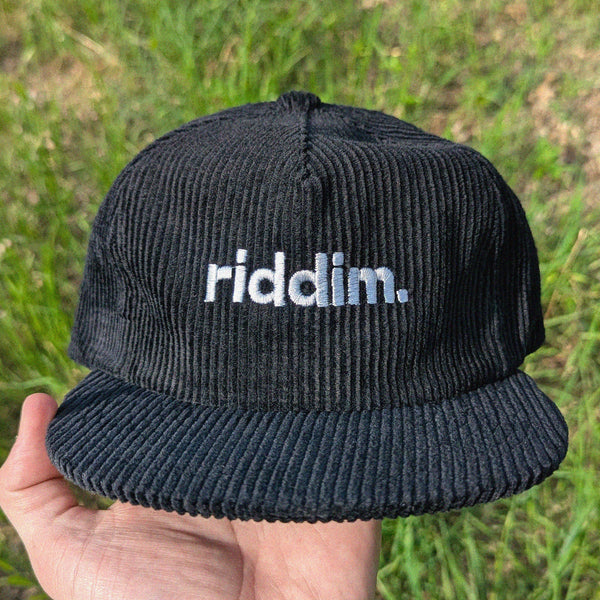 Black corduroy rave cap with 'riddim' embroidery