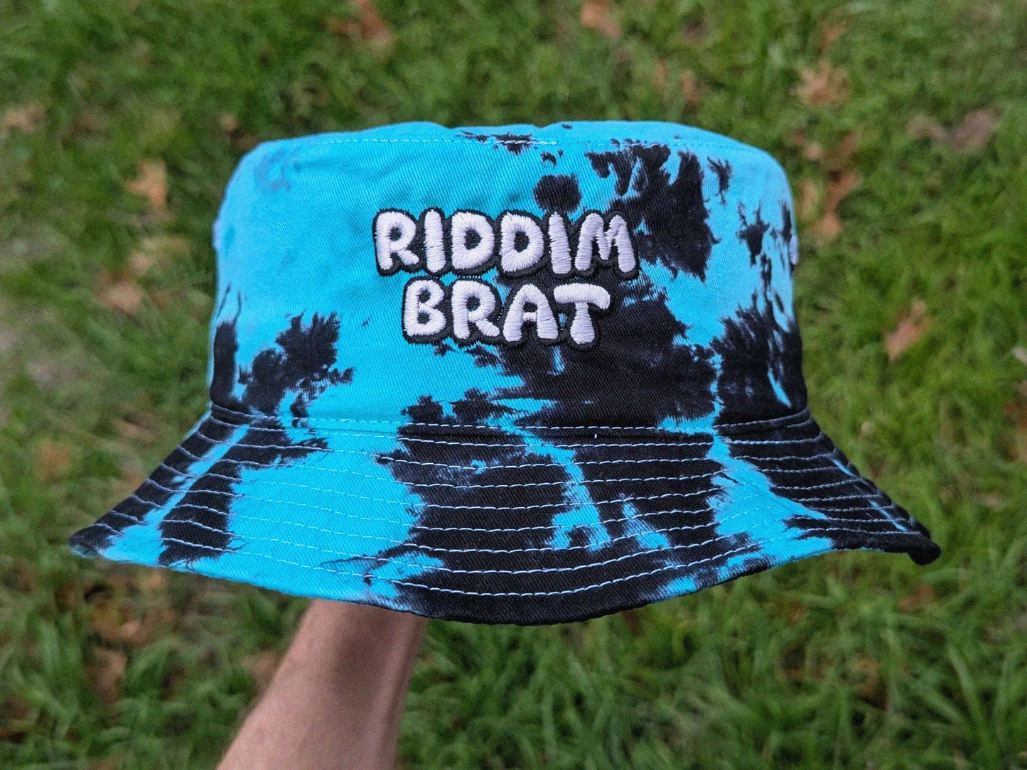 Teal and black tie dye bucket hat Riddim Brat embroidered rave festival headwear bass music