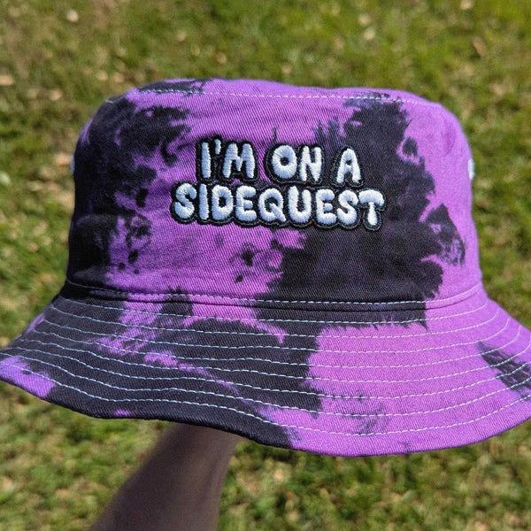 Tie dye rave bucket hat with "I'm On A Sidequest" embroidery