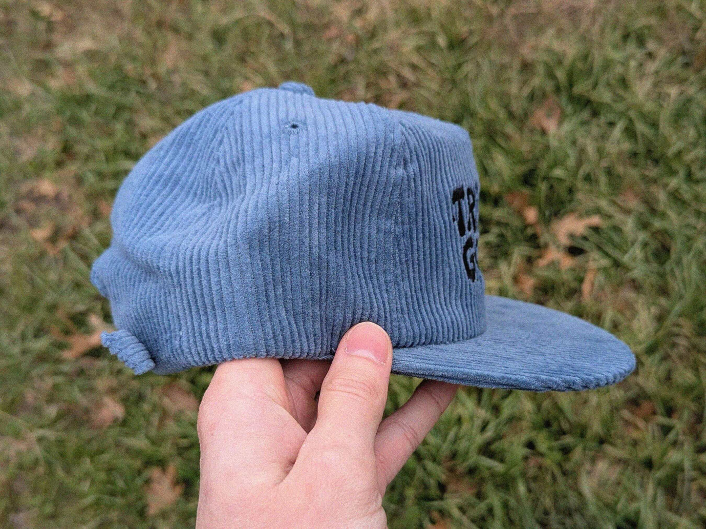 Side view of a blue corduroy rave hat. Men's rave accessories and women's rave hat